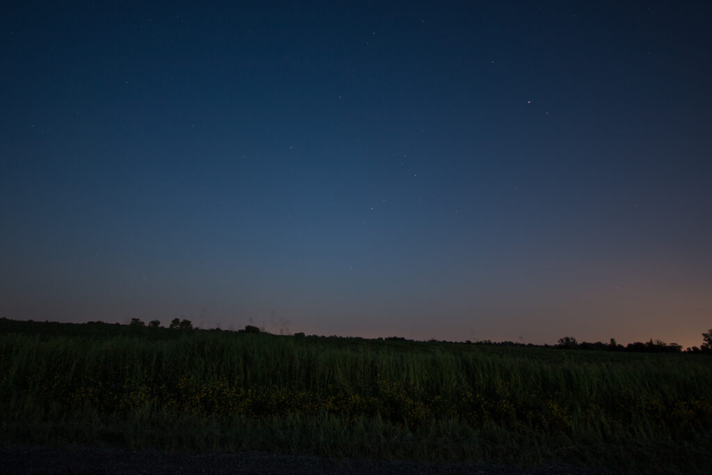 Stars just becoming visible after the sun has gone down